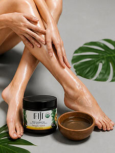 Woman applying organic coconut oil to her legs for a smooth shave.
